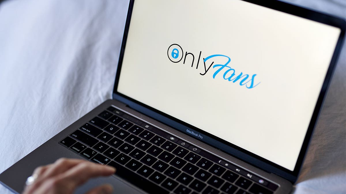 The OnlyFans logo on a laptop computer arranged in New York, U.S., on Thursday, June 17, 2021. OnlyFans, a site where celebrities and adult-film stars charge admirers for access to videos and photos, is in talks to raise new funding at a company valuation of more than $1 billion, according to people with knowledge of the matter. Photographer: Gabby Jones/Bloomberg via Getty Images