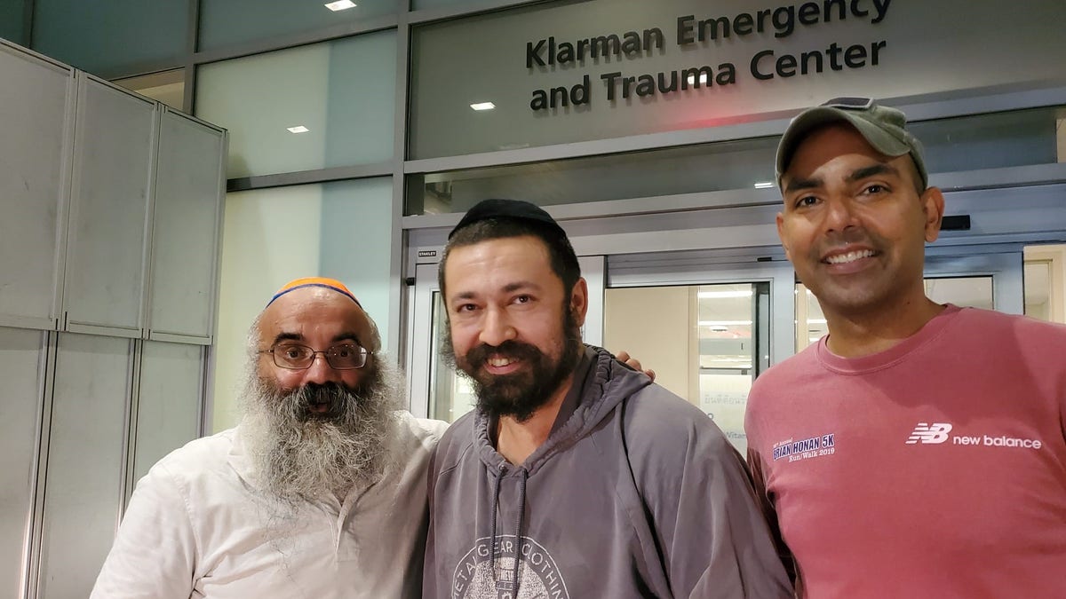 Rabbi Shlomo Noginski, middle, was released from the hospital on Thursday after being stabbed in the arm several times earlier in the day. 