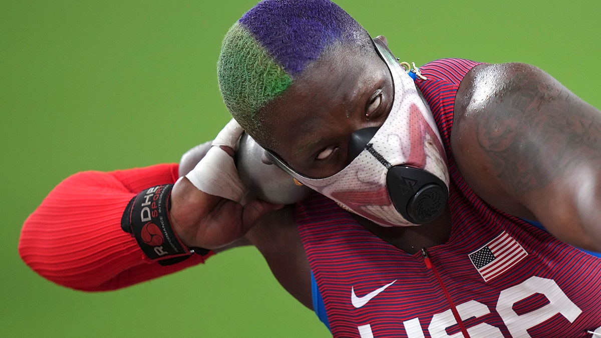 Raven Saunders of the United States competes in the qualification rounds of the women's shot put at the 2020 Summer Olympics, Friday, July 30, 2021, in Tokyo. (AP Photo/Matthias Schrader)
