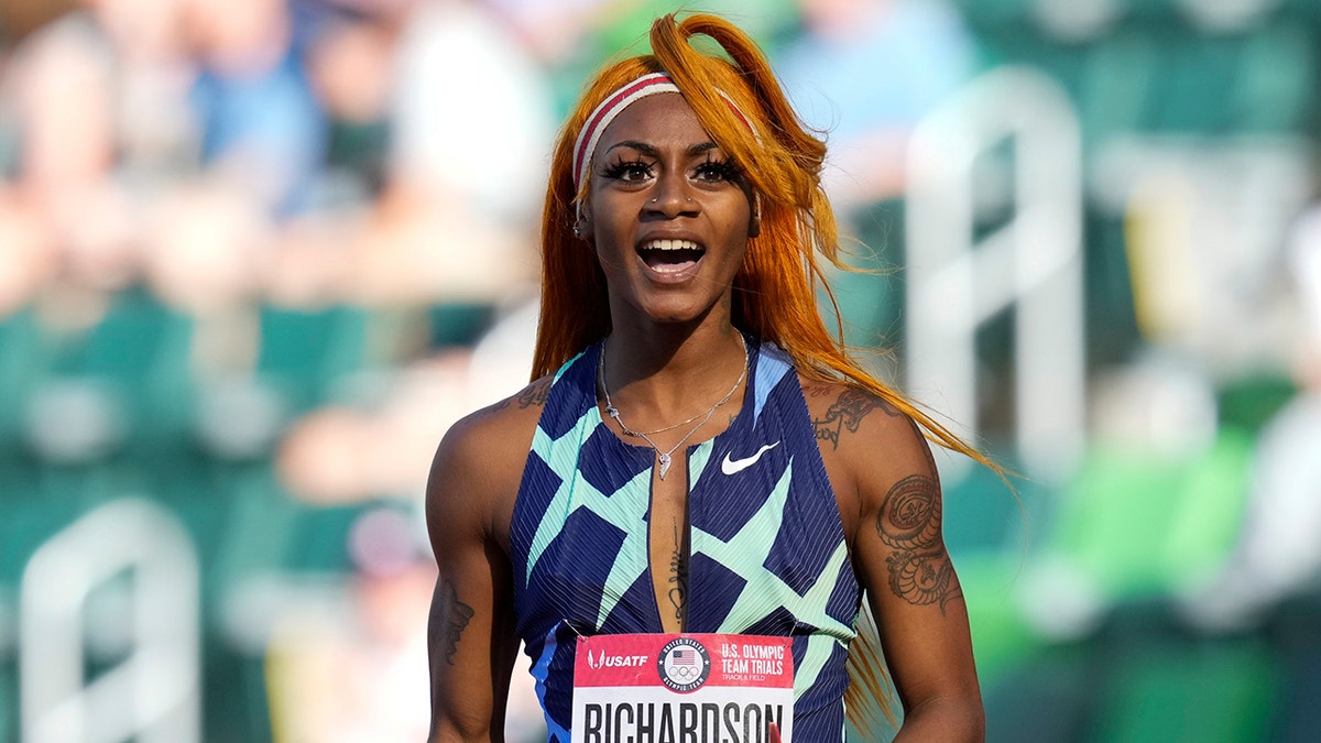 In this June 19, 2021 photo, Sha'Carri Richardson celebrates after winning the first heat of the semis finals in women's 100-meter runat the U.S. Olympic Track and Field Trials in Eugene, Ore. Richardson cannot run in the Olympic 100-meter race after testing positive for a chemical found in marijuana.  