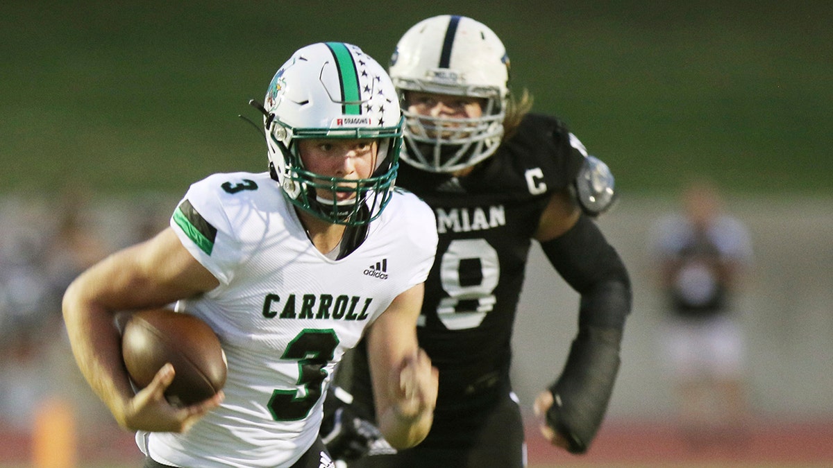 Under Pressure, Southlake Carroll's quarterback, Sophomore Quinn Ewers (3) runs the ball for a first down in the first quarter in their game against the Permian Panthers Friday night in Odessa Texas on September 13, 2019.