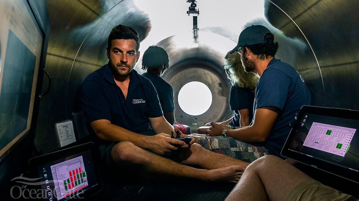 This undated photo provided by OceanGate Expeditions in June 2021 shows the interior of company's Titan submersible. The undersea exploration company plans to dive to the sunken Titanic as early as Wednesday, June 30, 2021, to begin what’s expected to be an annual chronicling of the shipwreck’s ongoing deterioration. (OceanGate Expeditions via AP)