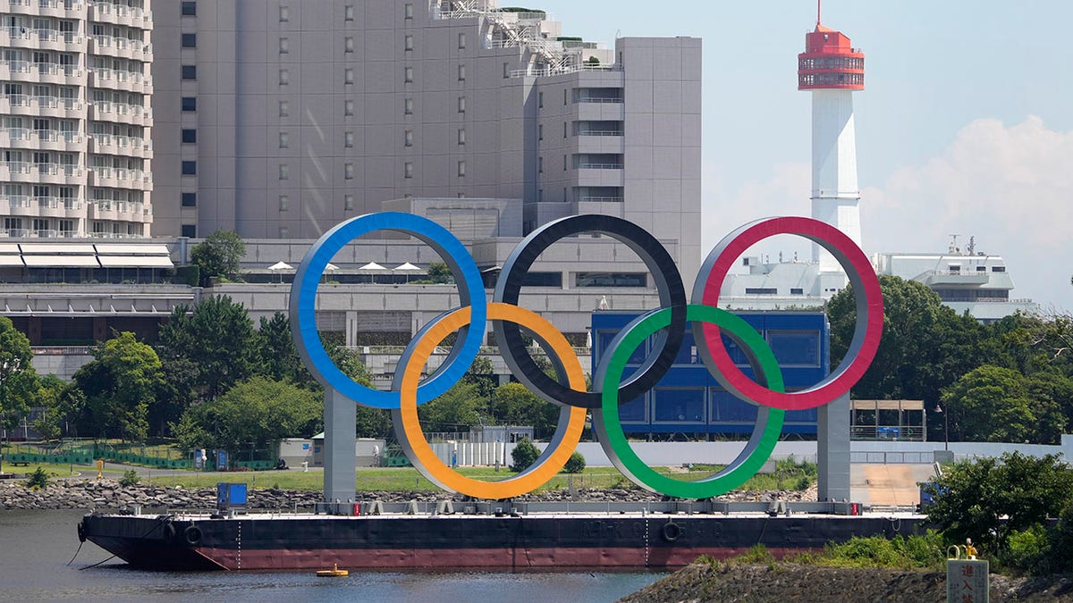 The Olympic rings float on a barge ahead of the 2020 Summer Olympics, July 19, 2021, in Tokyo.