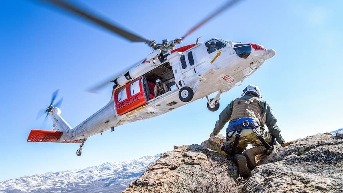 FILE PHOTO - FALLON, Nev. (April 8, 2021) An MH-60S Knighthawk helicopter assigned to the "Longhorns" of Helicopter Search and Rescue (SAR) Squadron, practices pinnacle landings and extractions during a mountain flying SAR training event. (U.S. Navy photo by Chief Mass Communication Specialist Shannon Renfroe)