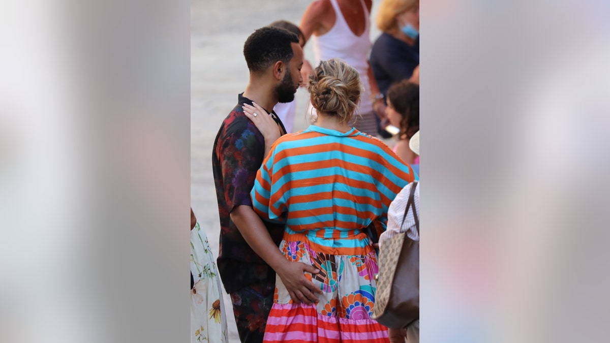 John Legend sweetly gives wife Chrissy Teigen a butt squeeze as the couple step out during their Italian getaway on July 6.