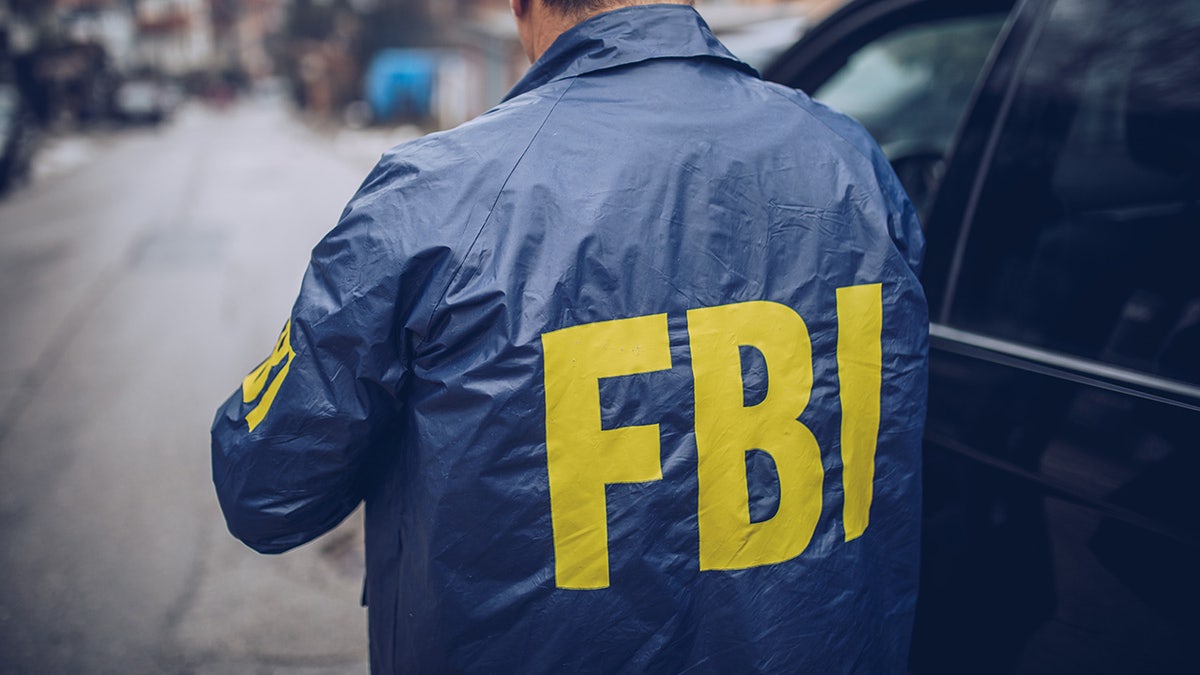 FBI agent wearing a FBI jacket