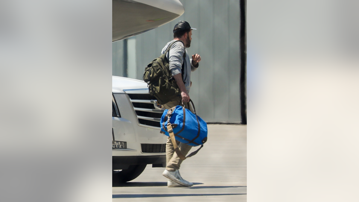 Ben Affleck returns from the Hamptons with Jennifer Lopez.