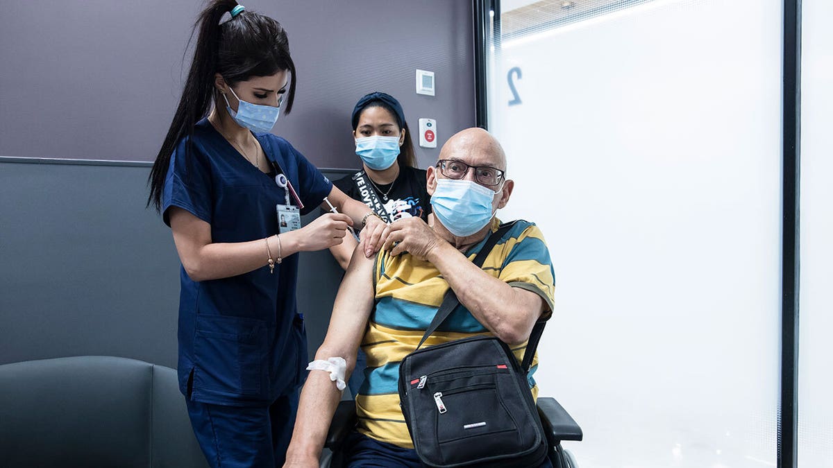 Yoel Mor, who recovered from cancer, receives his third dose of COVID-19 vaccine at Sheba Medical Center on July 14, 2021 in Ramat Gan, Israel.