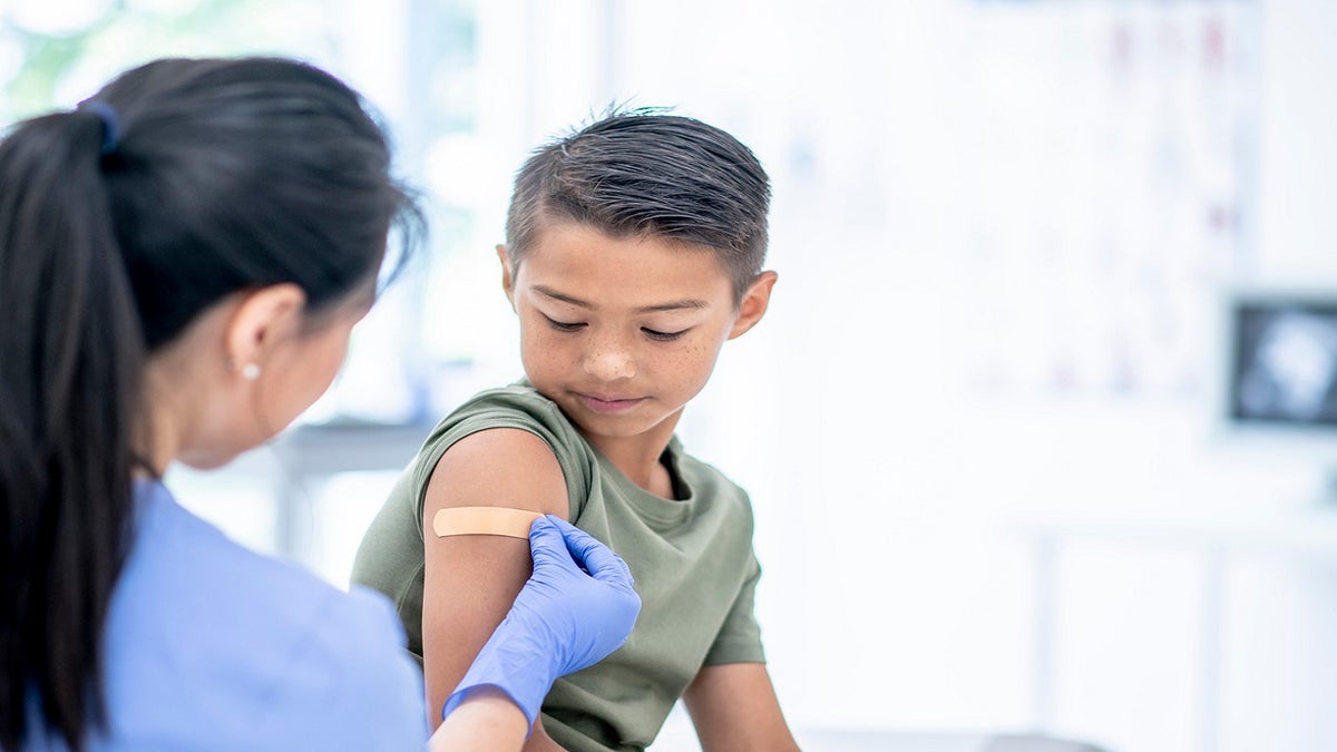 Young boy receives the COVID-19 vaccine