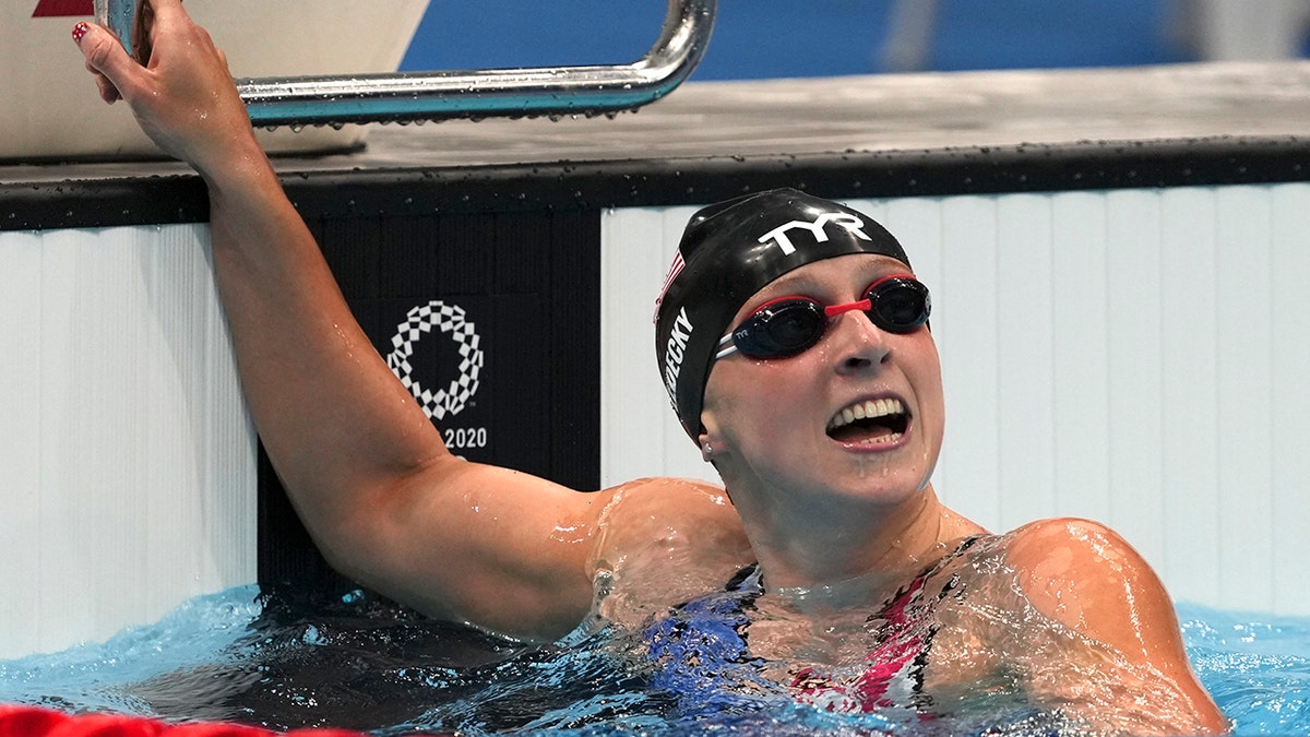 Katie Ledecky of the United States celebrates winning the women's 1500-meters freestyle final at the 2020 Summer Olympics, Wednesday, July 28, 2021, in Tokyo, Japan. (AP Photo/Matthias Schrader)