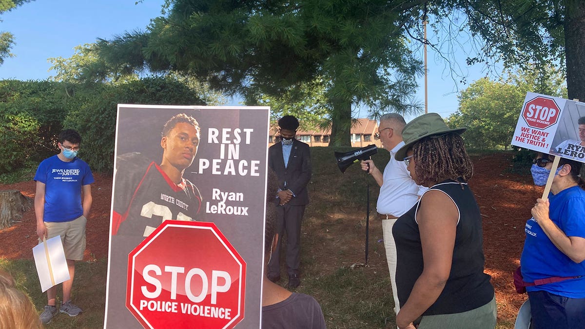Activists gather for a vigil on Tuesday, July 27, 2021 near the McDonald’s restaurant in Gaithersburg, Md., where Ryan LeRoux, a 21-year-old Black man, was shot and killed by police on July 16.