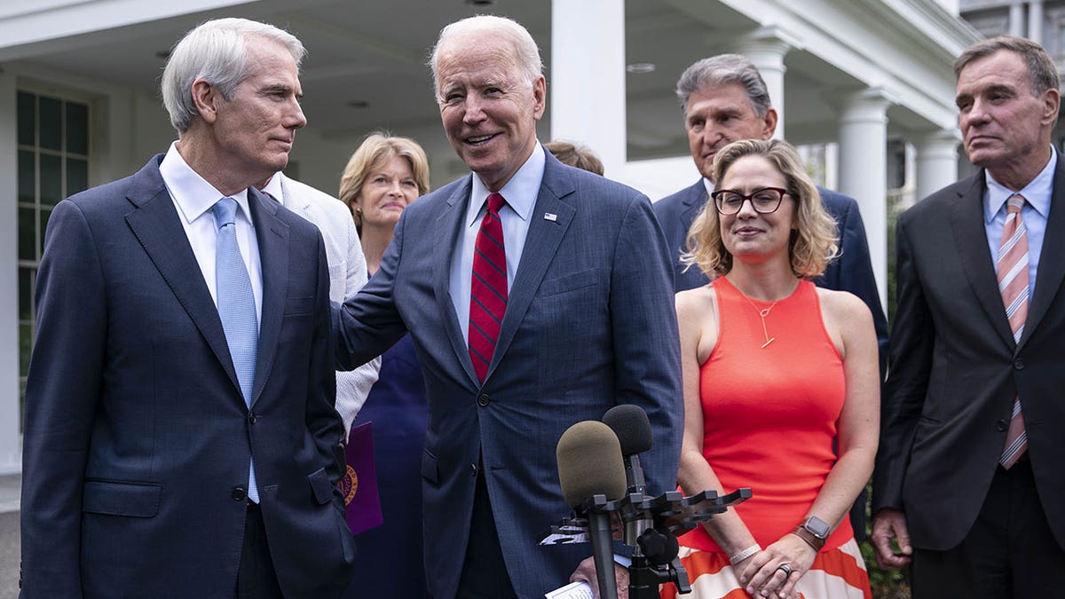 Senator Rob Portman speaks with Biden outside White House