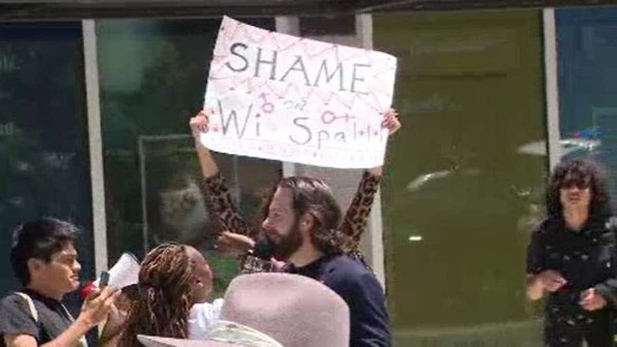 The dueling protests followed allegations that a transgender customer showed girls and teens her genitals. (FOX Los Angeles)