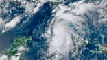 This GOES-16 GeoColor satellite image taken Monday, July 5, 2021, at 4:50 p.m. EDT, and provided by NOAA, shows Tropical Storm Elsa over western Cuba with strong rain and winds. Forecasters say it will move on to the Florida Keys on Tuesday and Florida’s central Gulf coast by Wednesday. The storm is moving over mainly rural areas to the east of Havana on Monday after making landfall near Cienega de Zapata, a natural park with few inhabitants. (NOAA via AP)