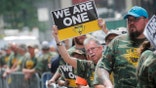 Members of United Mine Workers of America (UMWA) and other labor leaders picket about the union's strike at Warrior Met Coal Mine, outside BlackRock's Headquarters in New York City, U.S., July 28, 2021.  REUTERS/Brendan McDermid