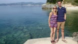 Stu and Jenny Urquhart in Corfu. See SWNS story SWBRring. A wedding ring that was lost at sea has been found two months later - on the couple's wedding anniversary.  Jenny Urquhart thought she’ never see her ring again after it fell off while she was surfing in Devon in May. After being unable to find it in a frantic initial search, the artist decided to put a drawing of the ring on social media, with an appeal for anyone who may find it to get in touch. And amazingly, she was contacted 11 weeks later by a metal detectorist, who'd spent three days searchi
