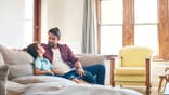 Father and son on sofa