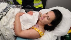 Opera singer gives birth in moving car while husband drives