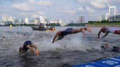 Olympics triathlon briefly delayed after boat moves into athletes' way in bizarre scene