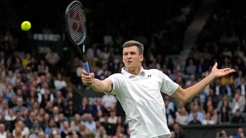 Hurkacz faces idol Federer in 1st Grand Slam quarterfinal