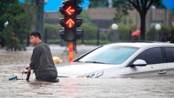 China flooding kills 12, turns streets into rivers