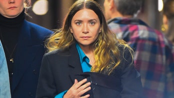 Ashley Olsen spotted hiking with a machete and a drink in rare outing with longtime boyfriend