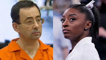 Simone Biles retweets message from gymnastics coach alluding to Larry Nassar abuse