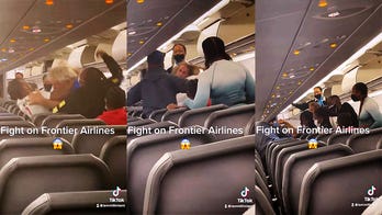 Airplane brawl caught on video shocks passengers, alleged racial slur used