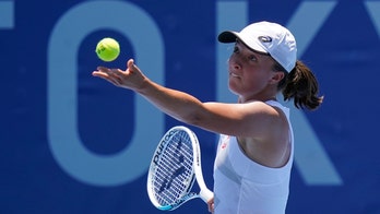 Swiatek, daughter of an Olympian, wins Tokyo tennis opener