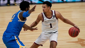 Choosing basketball over football was tough for Jalen Suggs