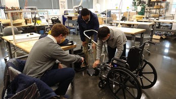 High school students build wheelchair stroller to help father walk his newborn