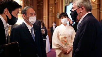 Japanese PM Suga says world should see safe Olympics staged