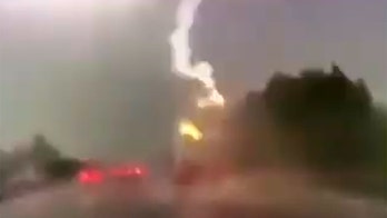 Lightning strikes truck in shocking video — Here's why the driver survived