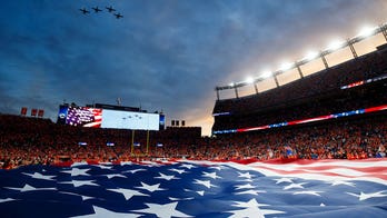 US Marine mom holds up 'I don't kneel' sign during ESPN show