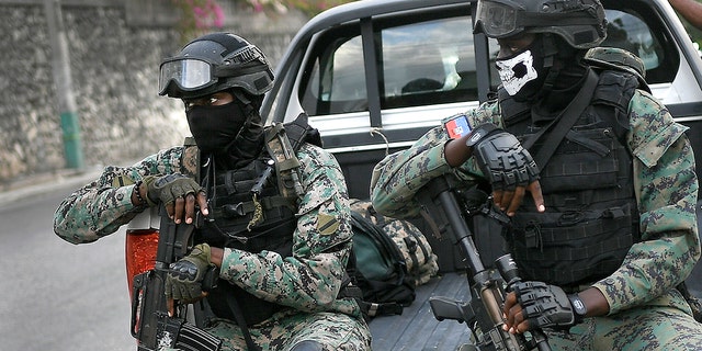 Soldiers stand guard near the residence of interim President Claude Joseph in Port-au-Prince, Haiti, Sunday July 11, 2021, four days after the assassination of Haitian President Jovenel Moise.  (AP Photo / Matias Delacroix)