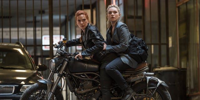 This image released by Marvel Studios shows Scarlett Johansson, left, and Florence Pugh in a scene from "Black Widow." 