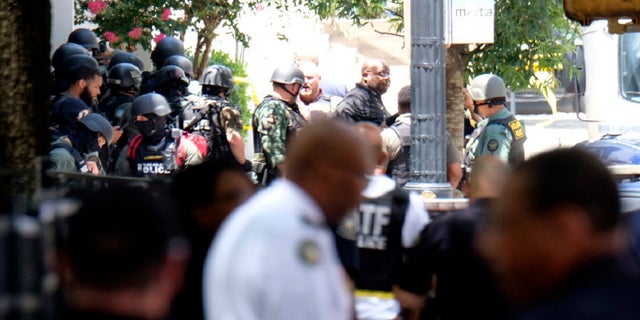 Several streets are closed in the Midtown area of Atlanta, after a police officer was shot at an apartment building Wednesday afternoon, June 30, 2021. (Ben Gray/Atlanta Journal-Constitution via AP)