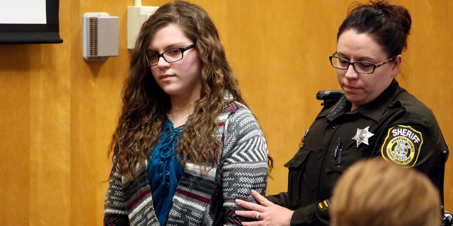 Anissa Weier, one of two Wisconsin girls who tried to kill a classmate to win favor with a fictional horror character named Slender Man, is led into court for her sentencing hearing in Waukesha, Wisconsin.