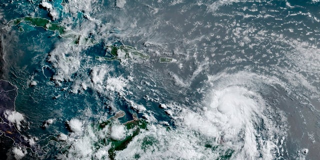 This satellite image provided by the National Oceanic and Atmospheric Administration shows Hurricane Elsa moving through the Caribbean, over Barbados. Elsa was expected to pass near the southern coast of Hispaniola on Saturday and to move near Jamaica and portions of eastern Cuba on Sunday. (Associated Press)