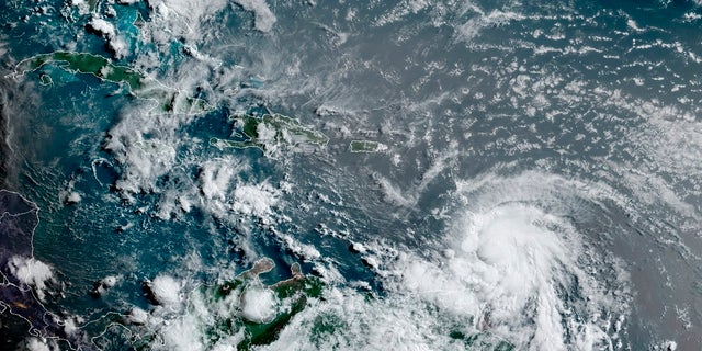 This satellite image provided by the National Oceanic and Atmospheric Administration shows Hurricane Elsa moving through the Caribbean, over Barbados. Elsa was expected to pass near the southern coast of Hispaniola on Saturday and to move near Jamaica and portions of eastern Cuba on Sunday. (Associated Press)