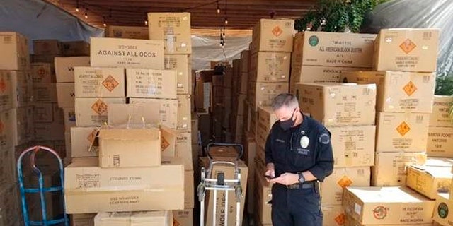 This July 2021 photo released by the ATF/United States Attorney's Office Central District of California, shows boxes of illegal large homemade fireworks explosives in South Los Angeles. Authorities found over 500 boxes of commercial grade fireworks in large cardboard boxes. (Associated Press)