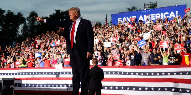 Former President Donald Trump walks on stage during a rally at the Sarasota Fairgrounds Saturday, July 3, 2021, in Sarasota, Fla. (AP Photo/Jason Behnken)