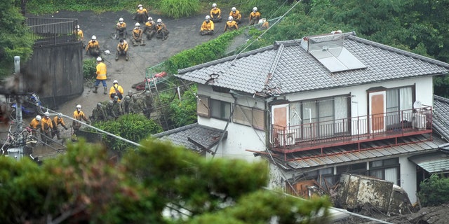 Houses are damaged by a mudslide following heavy rains in Izusan District of Atami, Shizuoka Prefecture, west Tokyo, on Sunday, July 4, 2021. The mudslide carrying a deluge Black water and debris crashed into rows of houses in the city following heavy rains on Saturday, leaving several people missing, officials said. (AP Photo / Eugene Hoshiko)