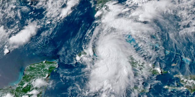 This GOES-16 GeoColor satellite image taken Monday, July 5, 2021, at 4:50 p.m. EDT, and provided by NOAA, shows Tropical Storm Elsa over western Cuba with strong rain and winds.