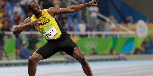 Usain Bolt from Jamaica celebrates winning the gold medal in the men's 200-meter final during the 2016 Summer Olympics in Rio de Janeiro, Brazil.