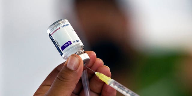 A health worker prepares to administer a jab of the AstraZeneca COVID-19 vaccine during a vaccination drive for people ages 30 to 39 in Mexico City, Wednesday, July 7, 2021. 