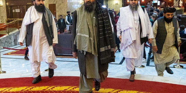 FILE - In this file photo taken Thursday, March 18, 2021, Taliban co-founder Mullah Abdul Ghani Baradar, center, arrives with other members of the Taliban delegation for an international peace conference in Moscow, in Russia. A Taliban delegation visited Moscow on Thursday, July 8, 2021 to offer assurances that their quick wins in Afghanistan do not threaten Russia or its allies in Central Asia. (AP Photo / Alexander Zemlianichenko, Pool, File)