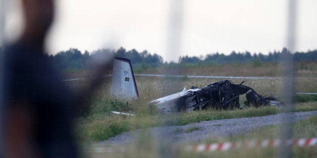 Emergency services at the scene of a small plane crash at Orebro airport in Sweden on Thursday, July 8, 2021. The plane was used by the local skydiving club with nine people on board. According to police, several deaths have been reported. (Jeppe Gustafsson / TT News Agency via AP)