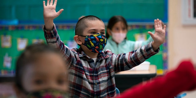 Kindergarten students participate in a classroom activity on the first day of in-person learning at Maurice Sendak Elementary School in Los Angeles, Calif., on April 13. (AP)