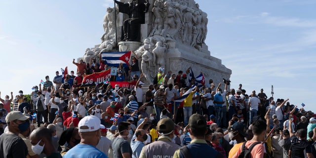 Anti-government protesters gather at the Maximo Gomez monument in Havana, Cuba, Sunday, July 11, 2021. (AP Photo/Eliana Aponte)